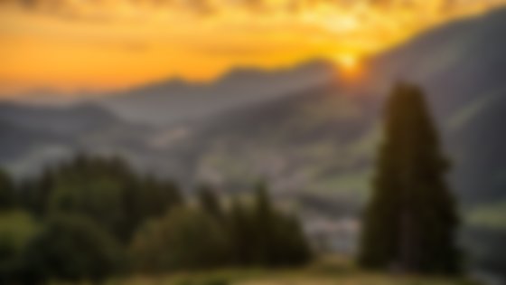 Golden hour sunset over a mountain village. © Sport Kessler GmbH